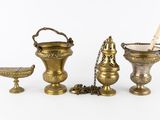 several different types of brass objects are displayed on a white surface