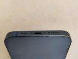 the back of an iphone with a blue back and a silver back
