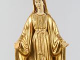 gold statue of a woman with a robe and a robe around her neck