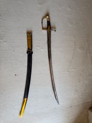 two knives that are on the wall next to each other