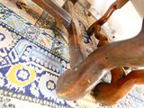 a close up of a wooden chair on a rug