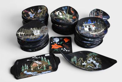 a lot of plates that have different designs on them
