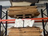 many pieces of wood stacked on the shelves in the warehouse