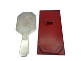 a red box and a silver key on a white background