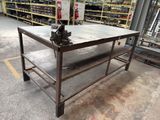 a metal table with a metal top in a warehouse