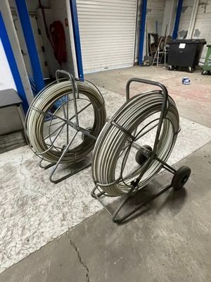 two hoses that are sitting on a cart