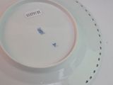 a white plate with a blue and white design on it