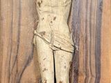 a wooden plaque with a statue of a man on it