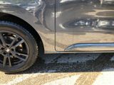 a close up of a car ' s tire on the pavement