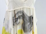 a white and yellow dress on a mannequin mannequin mannequin mannequin mannequin mannequin mannequin mannequin mann