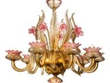 an image of a chandelier with pink flowers hanging from it ' s ceiling
