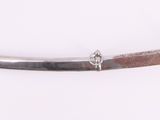 a silver sword with a gold ring on it