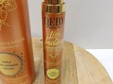 a bottle of body lotion and a bottle of body lotion on a wooden board
