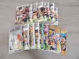a lot of anime books that are on the table