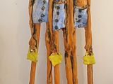 a sculpture of a group of people made out of sticks