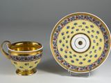 an image of a cup and saucer with a saucer on the side