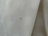 a close up of a person wearing a white jacket
