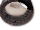 a tire that has been wrapped in plastic to protect it from the sun