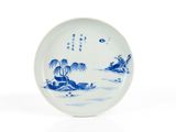 assiette en porcelaine bleue et blanche ornée d'un paysage