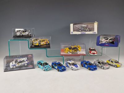 a lot of toy cars that are on display on a shelf