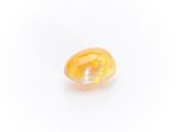 a yellow oplite stone on a white background