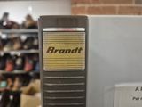 a picture of a bin with a bunch of shoes on it