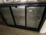 an image of a refrigerator with glass doors in a kitchen