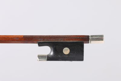 a close up of a violin bow on a white background