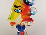 a close up of a glass sculpture of a woman ' s face