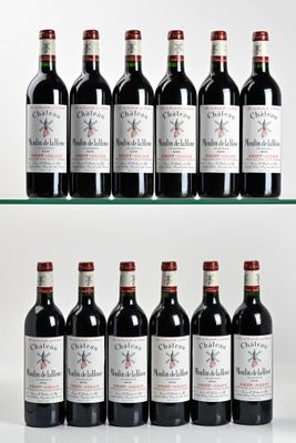 six bottles of red wine are lined up on a glass shelf