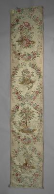an old rug hanging on a wall next to a white wall