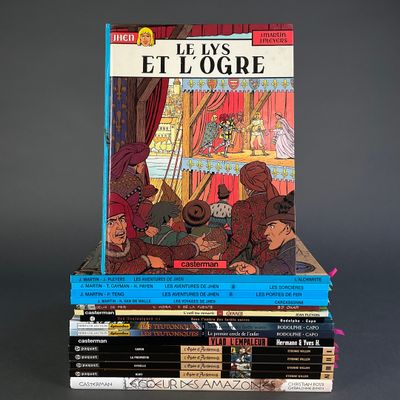 many books stacked on top of each other on a table