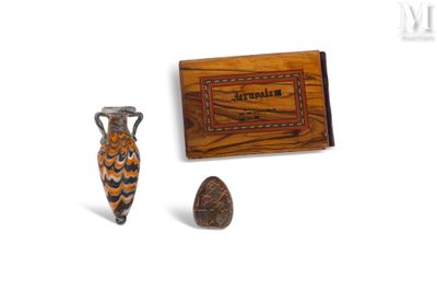 two vases and a box on a white surface