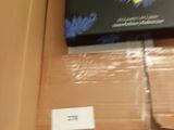 a laptop computer sitting on top of a box on a shelf