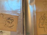 two drawings of a man and a woman on a piece of paper