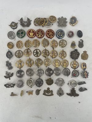 lot of vintage and antique military badges and badges