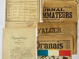 some old papers are sitting on a table next to each other