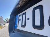 a close up of a number plate on the back of a car