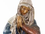 figurine of a woman holding a baby in her arms
