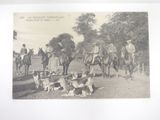 a lot of people that are riding horses and dogs