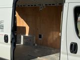 a white van that is parked on the side of the road