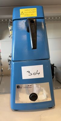 a blue refrigerator that has a sticker on it
