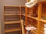 a room that has a shelf with a lot of items on it