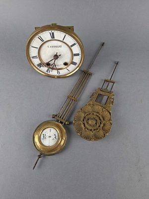 two clocks that are sitting next to each other on a table