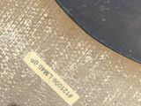 a close up of a metal object with a label on it