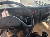 a steering wheel and dashboard of a truck