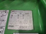 a close up of a green machine with instructions on it