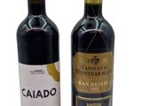 two bottles of wine sitting next to each other on a white surface