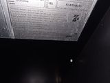 a picture of a black microwave oven with the door open