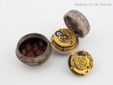 three different types of jewelry sitting on a white surface